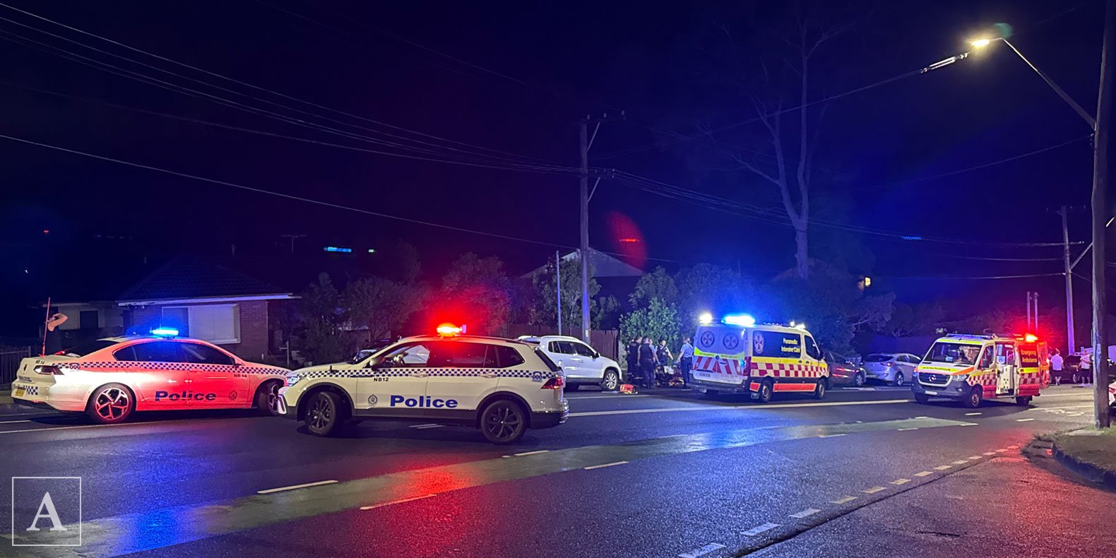 NSW Ambulance and NSW Police restrain a suspect at Allambie Heights NSW Ambulance and NSW Police restrain a suspect at Allambie Heights