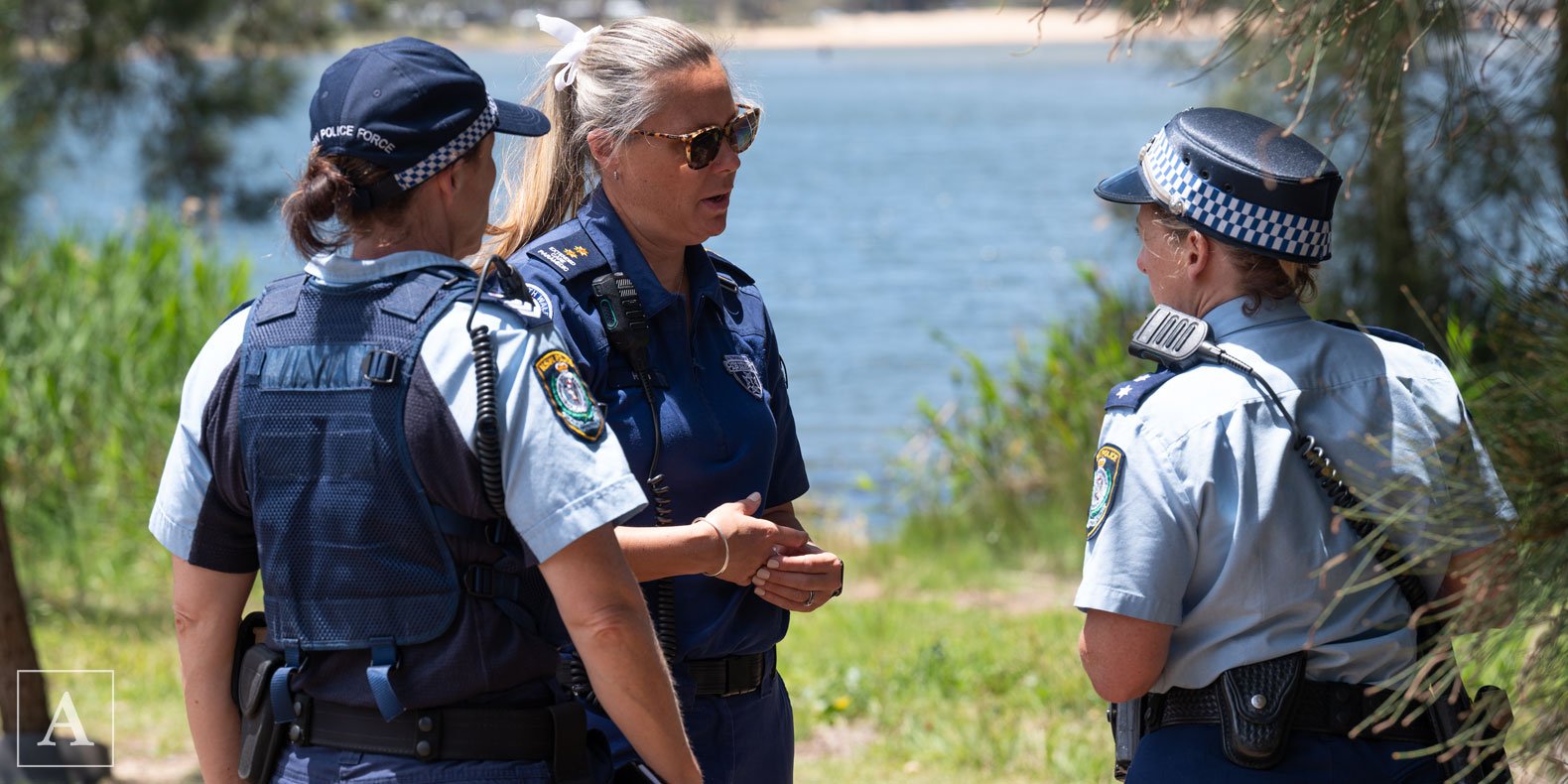 NSW Ambulance Supervisor Ree Lane talks to NSW Police after an officer is injured in an arrest NSW Ambulance Supervisor Ree Lane talks to NSW Police after an officer is injured in an arrest