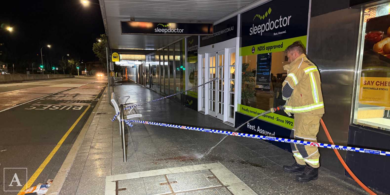 FRNSW hose down blood following an assault at Pittwater Road, Dee Why FRNSW hose down blood following an assault at Pittwater Road, Dee Why
